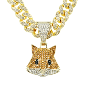 Close-up of hip hop fox pendant with orange crystals and golden cuban link chain