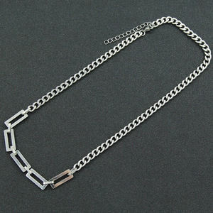 Detailed view of silver stainless steel Cuban link necklace with lobster clasp closure