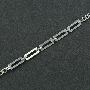 Industrial minimalist silver cuban link necklace featuring rectangular cutout chain design