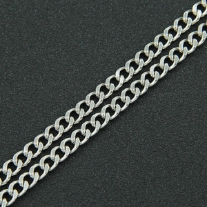 Minimalist silver Cuban curb chain necklace with polished metal links on black background