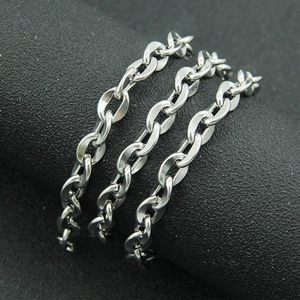 Polished silver stainless steel O-chain necklace for men and women on a dark display stand