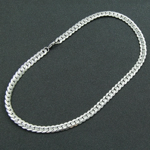 Flat silver curb chain necklace in stainless steel with textured links and lobster clasp