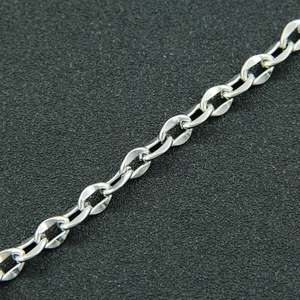 Macro shot of silver titanium steel curb chain with polished flat oval links