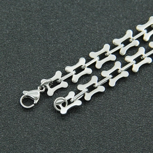 Detail of polished stainless steel bone link chain necklace with lobster clasp