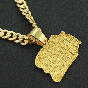Close-up of golden Cuban link chain and rectangle pendant with EVERY BODY text