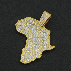 Macro shot of gold-plated iced-out Africa map pendant with micro pave zircon stones
