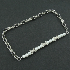 Punk style pearl and silver chain necklace with unique metallic thorn accents for women