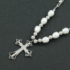 Silver cross pendant necklace with sparkling rhinestones and elegant pearls decoration