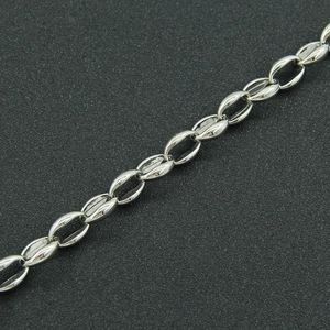 Macro shot of silver stainless steel chain necklace with unique textured oval links