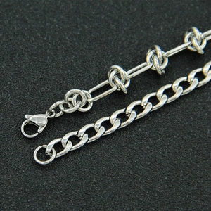 Minimalist silver Cuban chain link necklace with lobster clasp on black background
