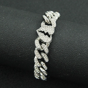 Hip hop cuban link bracelet in silver finish with iced out broken heart center piece