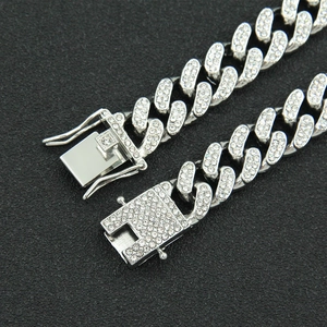 Men's hip-hop iced-out Cuban link bracelet with broken heart design in silver finish