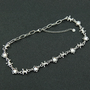 Minimalist silver thorn chain necklace with white stones and adjustable lobster clasp