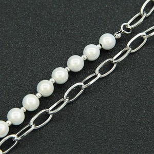 Asymmetrical heart pendant necklace with white pearls and silver steel chain detail