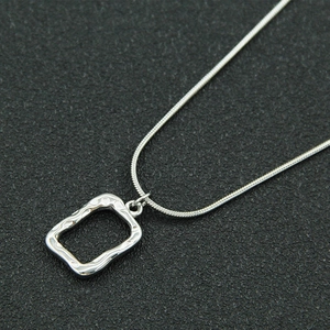 Silver stainless steel snake chain necklace with textured rectangular geometric pendant