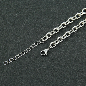 Detail of silver stainless steel cable chain with secure lobster clasp and extender