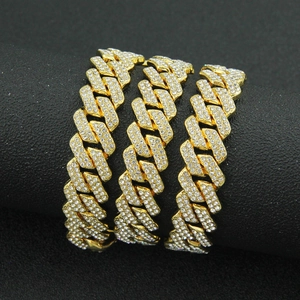 Iced out gold Cuban link chain necklace with sparkling crystals in hip-hop style