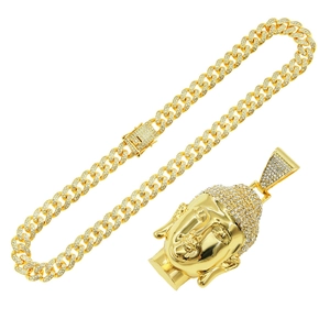 Hip hop jewelry set featuring a gold Cuban link chain with a sparkling crystal Buddha pendant