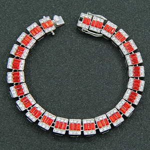 Hip hop style silver Cuban chain with red rectangular gemstones and micro-pave diamonds
