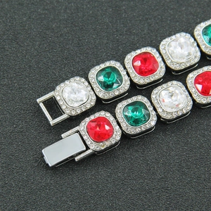 Macro shot of Cuban chain link necklace with multicolor square stones and paved diamonds