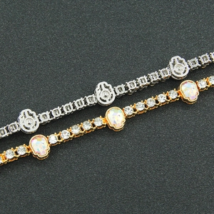 Hip hop tennis bracelet in gold and silver with pave zircon and iridescent skulls