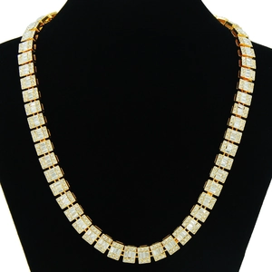 Close-up of iced out Cuban chain with red and white pavé baguette-cut zircon gems