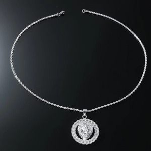 Detailed close-up of a silver hip-hop lion head pendant on a thick rope chain necklace