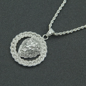Macro shot of silver hip hop lion head pendant with crystal pavé and rope chain