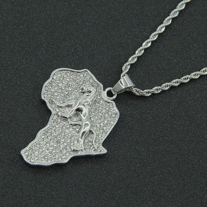 Macro view of iced-out Africa map pendant with a standing lion relief on a rope chain