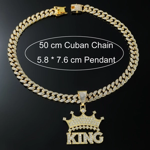Close-up of gold iced-out King crown pendant with 50cm cuban chain necklace
