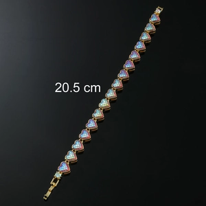 Detail view of 20.5 cm gold heart chain bracelet with colorful mermaid scales and rhinestones