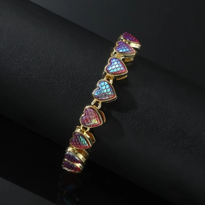 Chunky gold-plated bracelet featuring iridescent heart links on a black jewelry stand