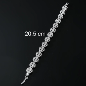 Close-up of 20.5 cm silver hip hop bracelet with iced-out pave crystal smile links