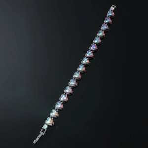Close-up of heart-shaped bracelet links with vibrant iridescent fish scale texture