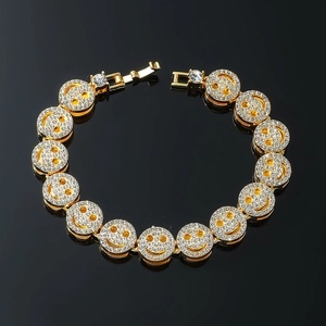 Hip hop gold bracelet with sparkling iced-out smiley face links and folding clasp