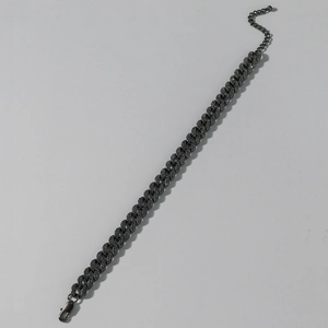 Detail view of gunmetal Cuban link anklet with black rhinestones and lobster clasp closure