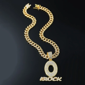 Men's hip hop gold Cuban link chain with iced-out O BLOCK letter pendant and pave diamonds