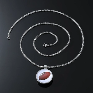 Hip hop style silver chain necklace featuring a circular American football pendant charm