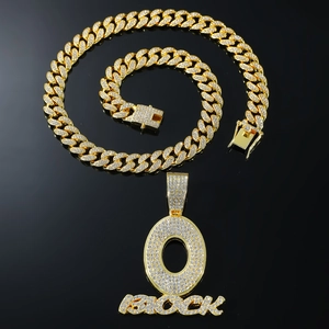 Iced-out hip hop gold necklace with large 'O BLOCK' letter pendant on a Cuban link chain