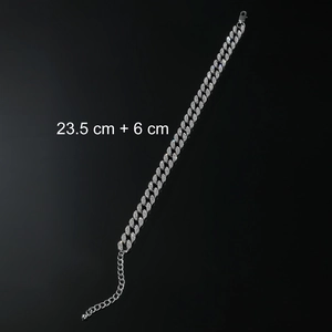 Detail of silver Cuban link anklet with crystals and 23.5cm extension chain on black