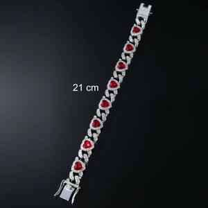Iced out silver bracelet with red heart stones and 21 cm length in hip-hop style