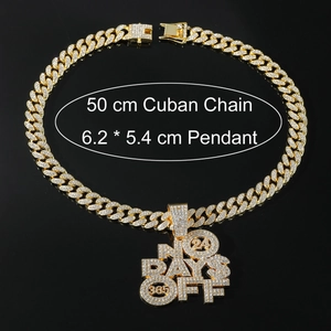 Macro shot of gold iced out No Days Off pendant with cuban chain necklace for men