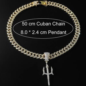Close-up of iced-out gold trident pendant and 50cm cuban chain with rhinestone detail