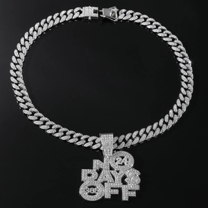 Close-up of hip hop Cuban chain with NO DAYS OFF iced-out rhinestone letter pendant
