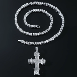 Hip hop tennis chain with a large iced out cross pendant in silver finish and cubic zirconia