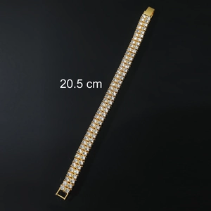 Detail of 20.5 cm double-row rhinestone bracelet in gold-plated finish with clasp