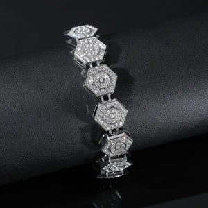 Close-up of hip-hop silver diamond bracelet with hollow hexagonal links on a display