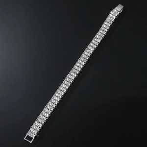 Macro shot of triple-row rhinestone tennis bracelet showing detailed crystal setting