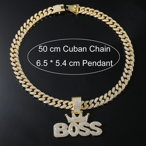 Detailed view of iced out gold BOSS crown pendant with 50cm cuban link chain
