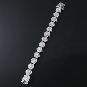 Macro detail of silver hip-hop bracelet featuring iced-out hexagonal links and secure clasp